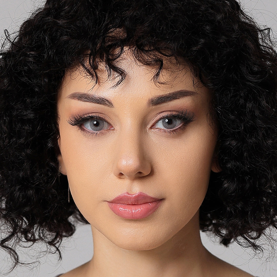 model wearing pearl gray colored contacts